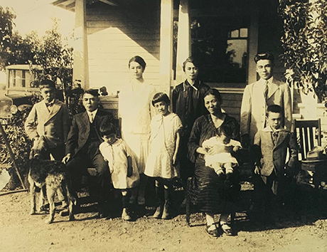 Joan’s mother’s family is photographed in front of their pagoda-modeled home in Mountain View. 