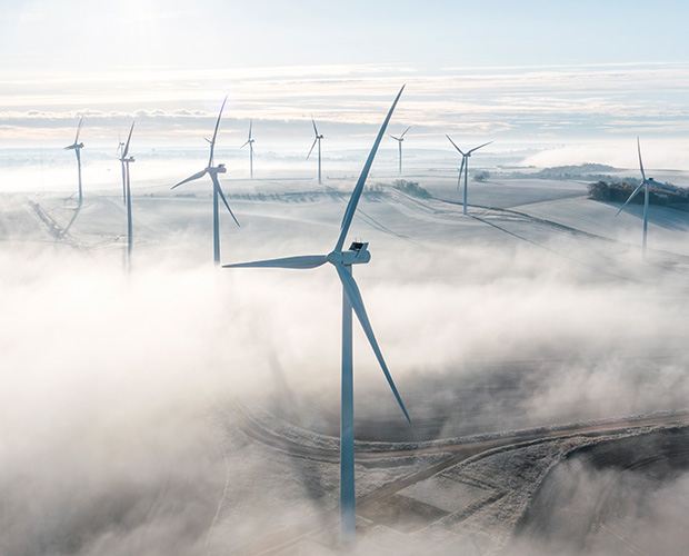 Windmills in fog